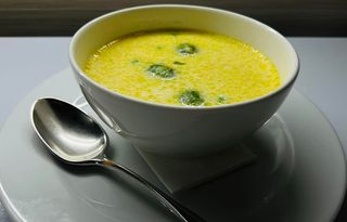 Cheese soup with green peas and Brusssels sprouts