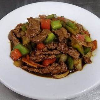 Lonchas De Buey Con Salsa De Ostras