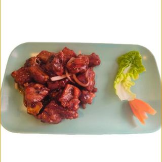 Costilla con salsa capital 