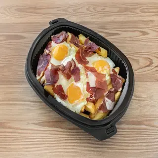 Huevos rotos con jamón gran reserva