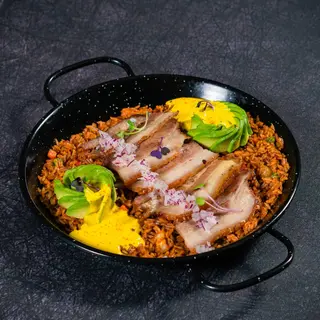 Arroz criollo con panceta confitada