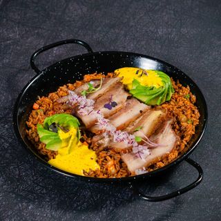 Arroz criollo con panceta confitada