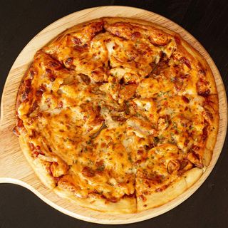 Saucy Chicken Supreme Pizza and a drink