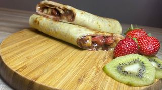 Pancake with strawberries, bananas and chocolate