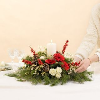 Centro de mesa redondo y vela