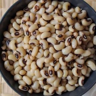 Boiled white oloyin beans with spicy stew