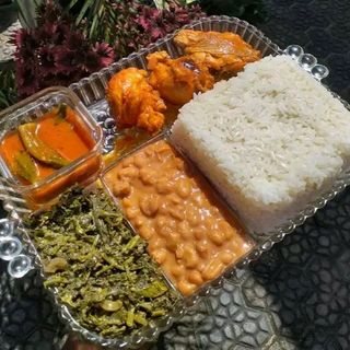 White rice , coconut beans,fried chicken and greens