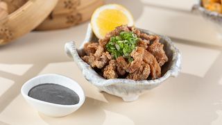 Chicken popcorn with black truffle sauce