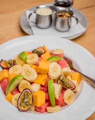 Seasonal Fruit Salad, Yogurt, Muesli, And Ugandan Honey