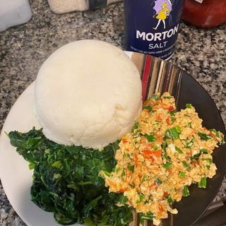 Sima (ugali) + scrambled eggs and greens