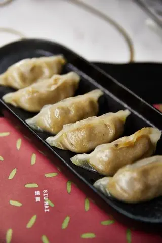 Raviolis de pato y foie a la plancha