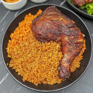 Jollof rice and deep fried chicken in Nigerian sauce 