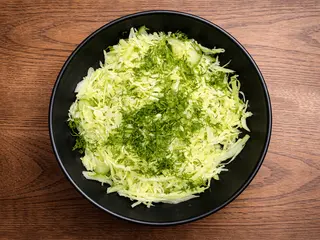 Салат з молодої капусти (200g)