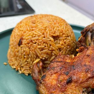 Special jollof rice served with deep fried chicken 