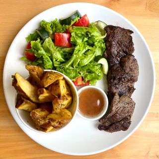Grilled Beef Medallion with  garden salad and red wine sauce