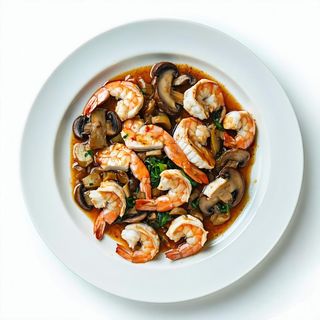 Pollo con gamberi e funghi