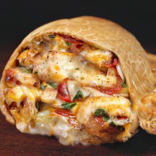 Jamón Ibérico, Rúcula, Tomate y Parmesano 