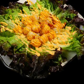 Tempura de langostinos tigre troceados en crema 