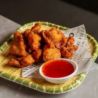 Pollo frito de Nagolla con salsa 炸鸡块