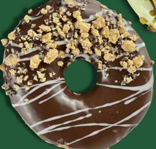 Donut con glassa al cioccolato e crumble cereali-e fave di cacao