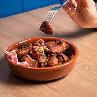 Ración de cochino frito 