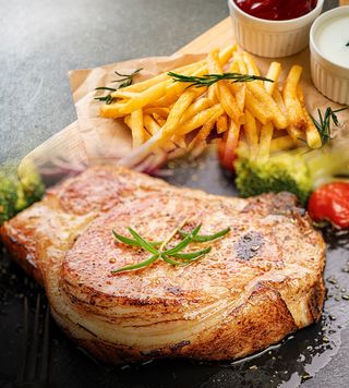 Pan fried pork, fries served with a garden salad