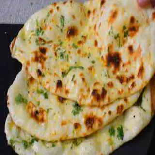 91. Butter naan ( contiene gluten)
