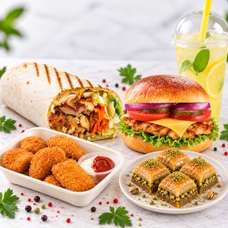 Meniu super(1kebab mare+1chessburger +Nuggets +baclava +limonadă )