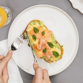 Avocado toast with scrambled egg and salmon