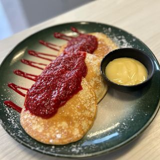 Z białą czekoladą i gorącymi malinami