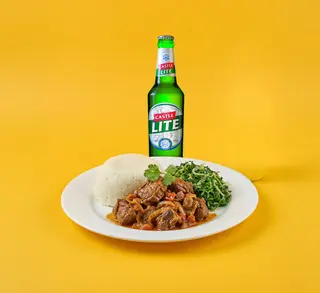 1/2 Wet fry goat, Posho, sukumawiki + Castle Lite