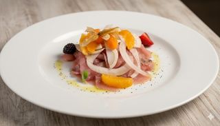 Carpaccio di ricciola con finocchi e arance di ribera al vivo