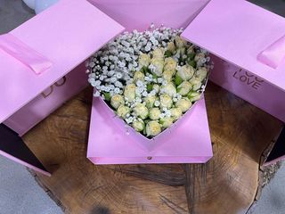 White roses with gypsophila in pink heart shaped box