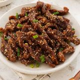 Deep fried beef with sesame seeds on top