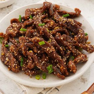 Deep fried beef with sesame seeds on top