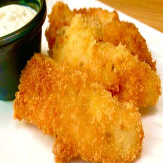 Ración de pescado empanado