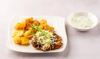 Panierowany filet z kurczaka z pieczarkami