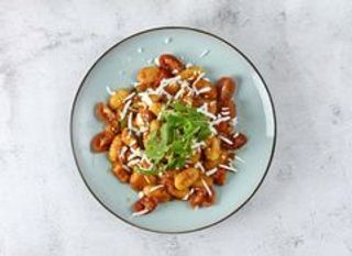 Gnocchi pomodorini confit stracciatella e mandorle