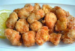 Dados De Pescados Fritos En Adobo Con Calabacín