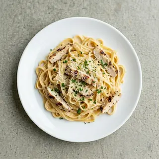 Alfredo pasta served with alfredo sauce