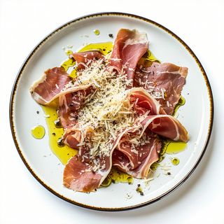 Cecina De León Con Aceite Y Queso Parmesano