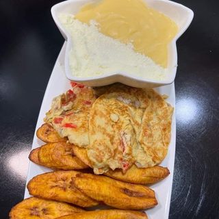 Fried potatoes served with pap/custard and egg sauce 
