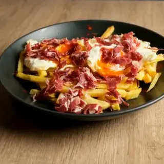 Huevos rotos con jamón