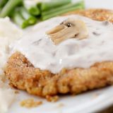 Escalope 4 Quesos + ración de patatas fritas caseras + ensalada LTC