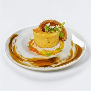 Parmentier de patata con huevos rotos, paletilla ibérica, torreznos