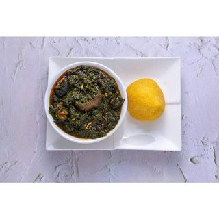 Afang soup, eba, goat meat and water