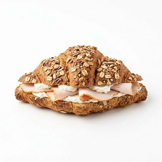 Croissant integral semillas pavo braseado+ queso crema+ mezclum