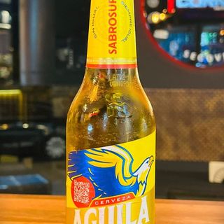 * CERVEZA AGUILA LIGHT TERCIO