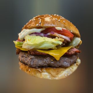 Burger arch deluxe ( 200g wołowiny ) + 100g frytek 