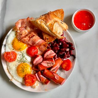 English Breakfast with Eggs, Bacon, Sausages and Beans